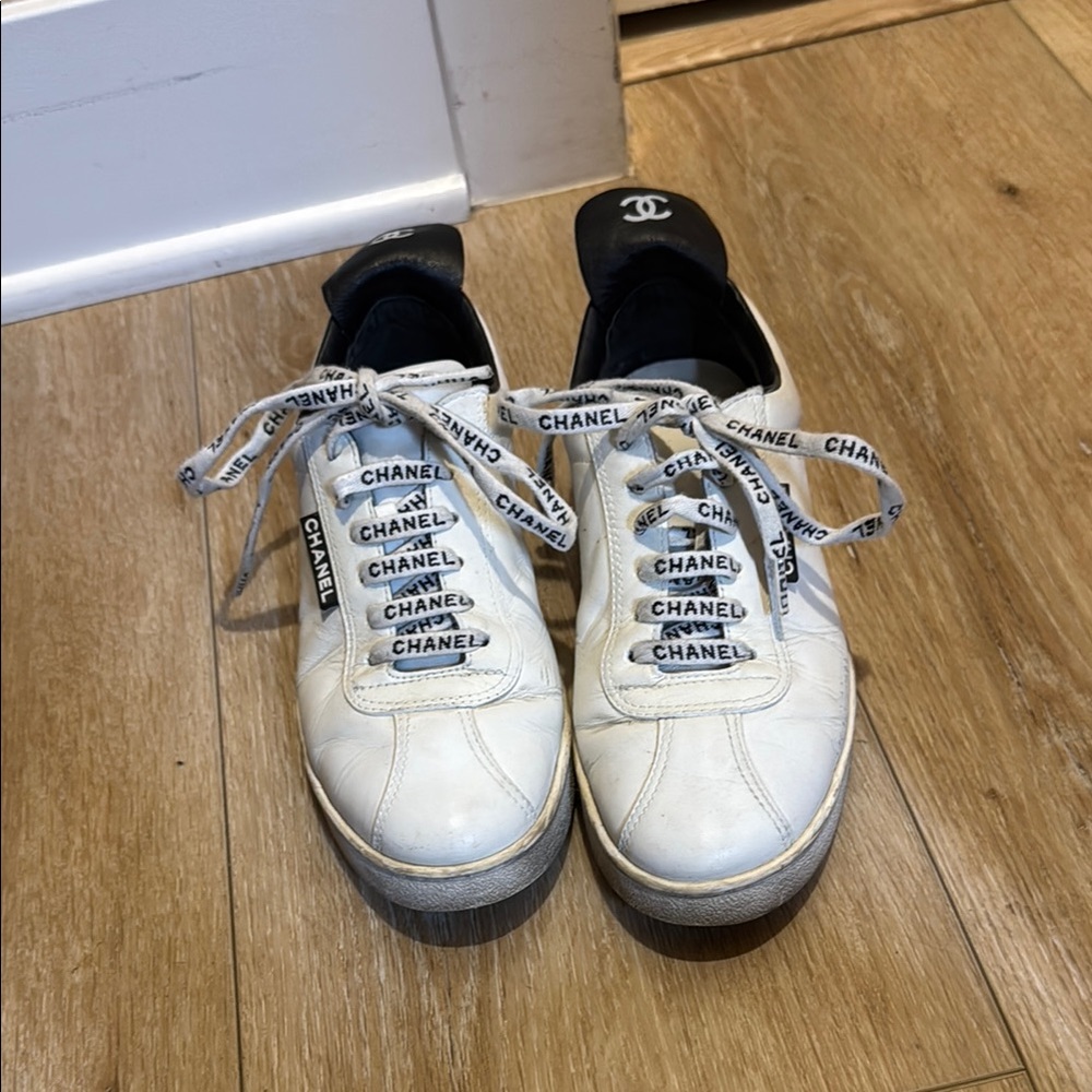 CHANEL White Sneakers with Black Accents